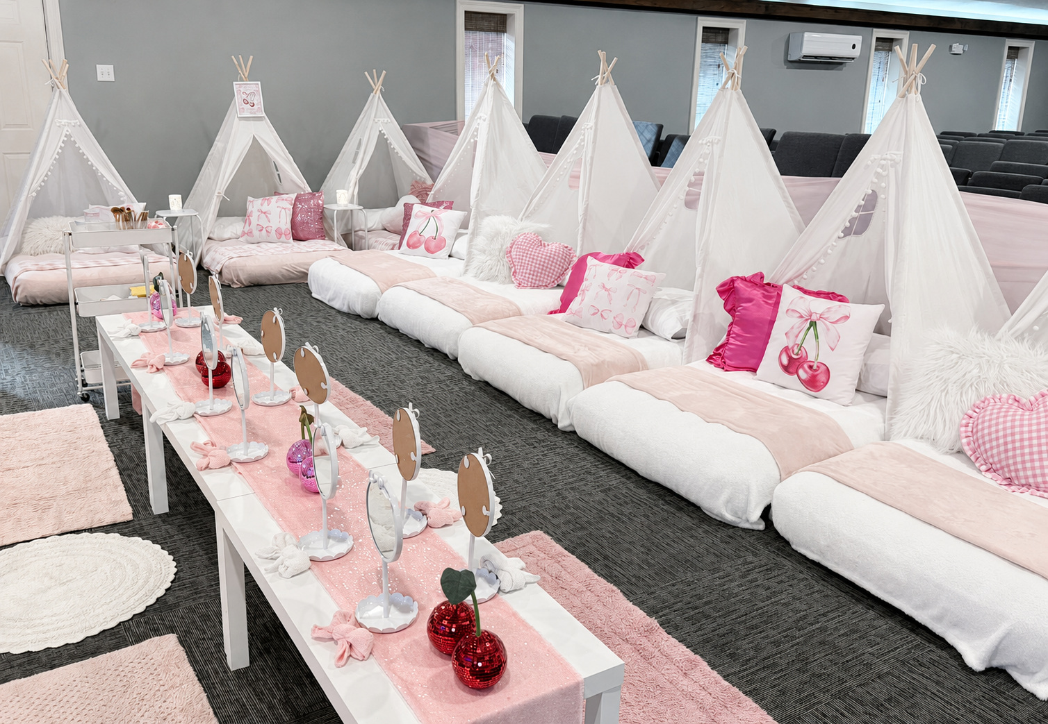 Pink cherry teepee party with a spa activity table